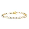 Classic gold tennis bracelet set with oval-cut gemstones